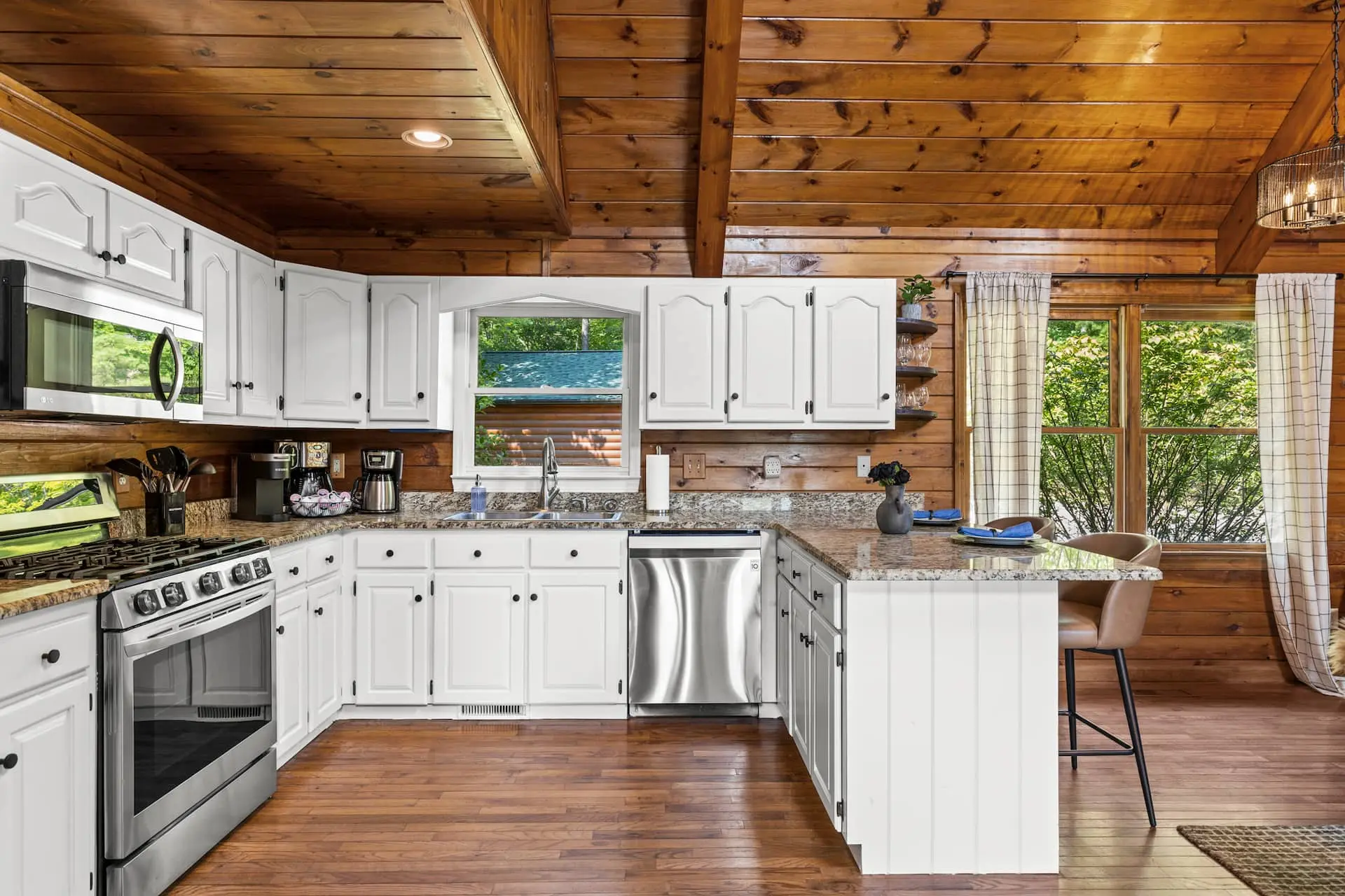A bright, fully equipped kitchen with granite counters and stainless appliances—perfect for morning coffee, home-cooked meals, and gathering together.