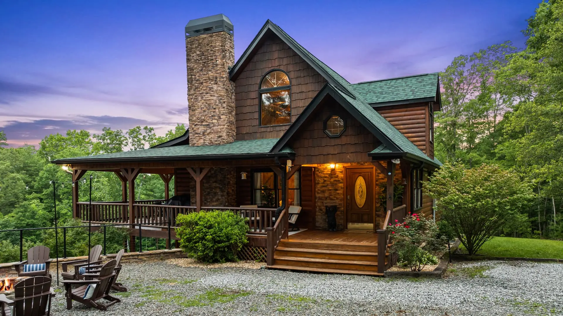 Welcome to your mountain retreat! This beautiful log cabin features a welcoming front porch, cozy outdoor seating around the firepit, and peaceful forest views—perfect for relaxing evenings under the stars.