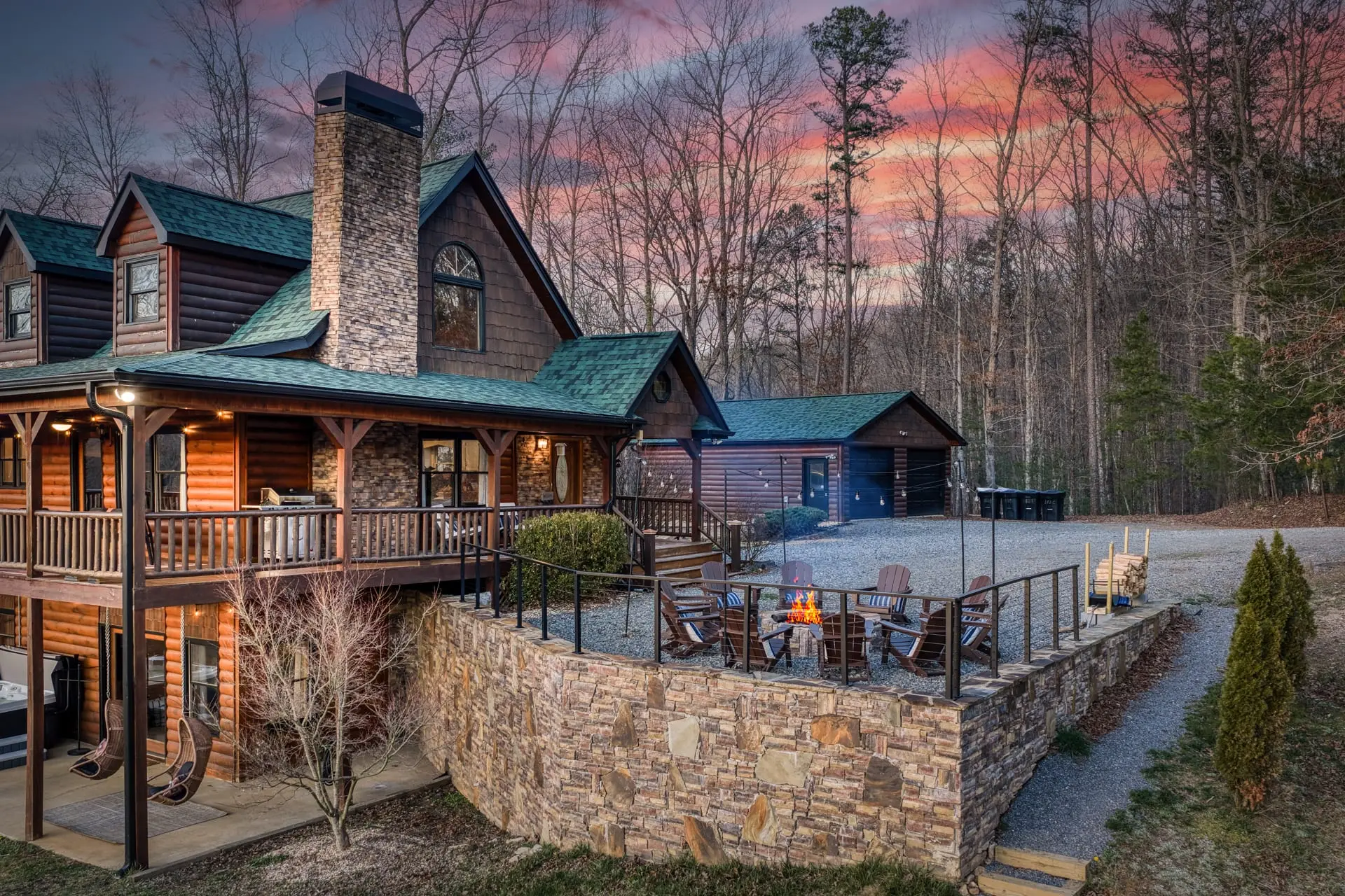 Cozy log cabin retreat with fire pit, wraparound deck, and porch swings